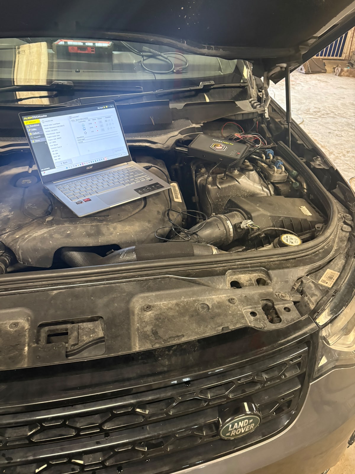 Alientech ECU remapping suite connected to a Land Rover Discovery engine bay in the Future Remapping workshop