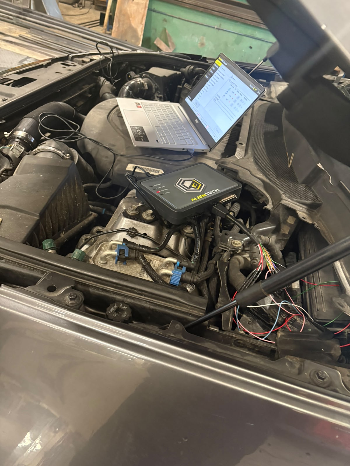 Alientech KESS tuning device wired into a diesel engine bay for a Stage 1 ECU remap
